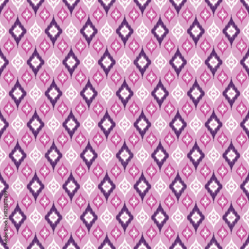 A repeating textile pattern with staggered, stylized diamond shapes in shades of magenta, dark purple, and white on a soft lilac background, characteristic of Ikat weaving.