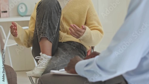 Teens and Counselor Holding Hands in Group Therapy Session