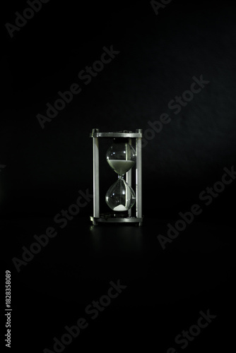 hourglass on black background