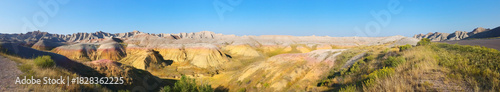 Expansive view of Badlands geological formations characterized by layered sedimentary rocks and eroded hills