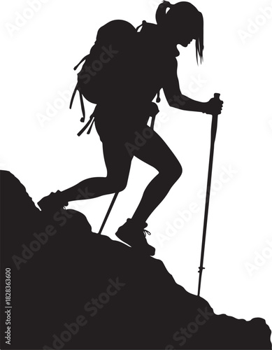 Silhouette of a woman hiking uphill with trekking poles