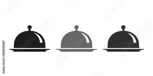Three minimalist service cloches on plates in black, gray, and dark gray shades