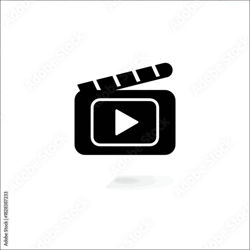 Black film clapperboard icon with a play button, on a white background with shadow