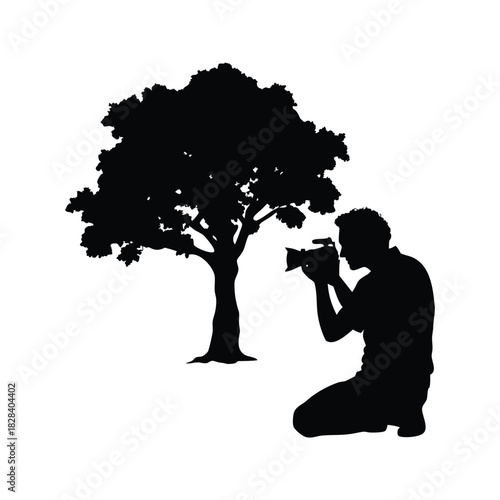 Silhouette of a photographer kneeling and taking a picture of a tree., person photographing oak tree silhouette vector illustration