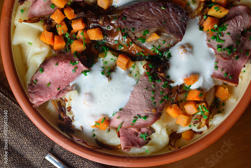 The Kazakh national dish Beshbarmak consists of boiled dough, meat and vegetables, sprinkled with sour cream.