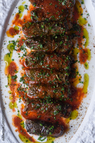 Central Asian dish, Dolma. juicy veal, fresh leaves and tomato sauce