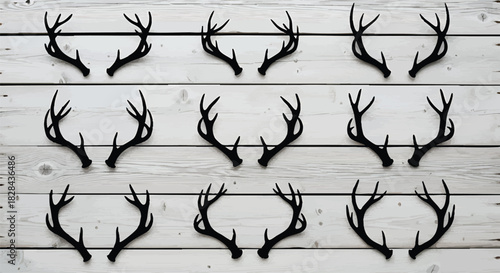 Collection of Silhouette Deer Antlers on Rustic White Wood Background Perfect for Country Western Theme or Wildlife Inspired Designs and Wall Art Projects