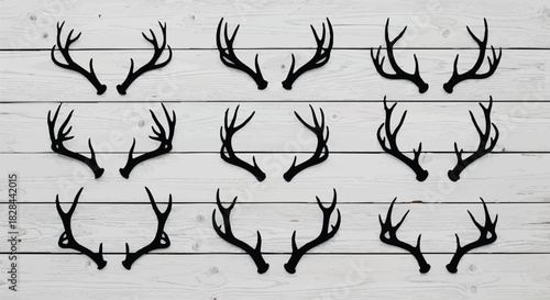 Collection of Silhouette Antlers on a Rustic Wood Background Perfect for Winter and Holiday Designs Featuring Elegant Decoration and Natural Elements Ideal for Festive Crafts