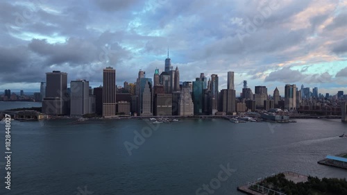 Wallpaper Mural Drone aerial view of New York City, New York showing waterfront edges, tall skyline towers and soft cloudy daylight spreading across the river and urban scene. Torontodigital.ca
