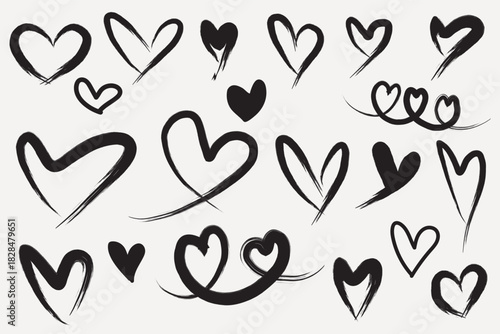 Hand drawn black brush heart doodle set