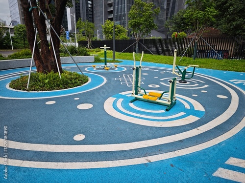 a low angle view of a small community playground near a residential block in shenzhen china