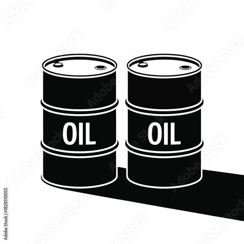 Two black oil barrels stand next to each other casting a shadow.