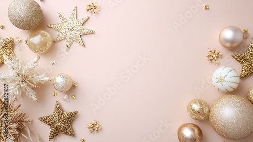 Christmas background with white and gold decorations, golden stars and spheres placed on a beige tabletop, with a light pink background. Blank space available for text or product display.