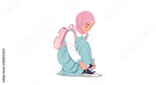 Young girl in hijab tying shoelaces while sitting on the ground with a backpack