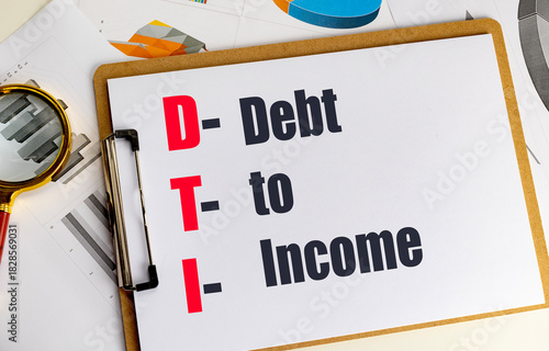 DTI abbreviation for debt to income written on clipboard with financial charts and magnifying glass