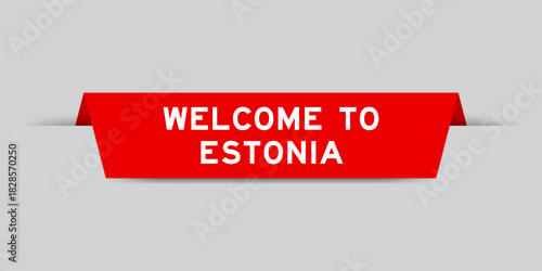 Red color inserted label with word welcome to estonia on gray background