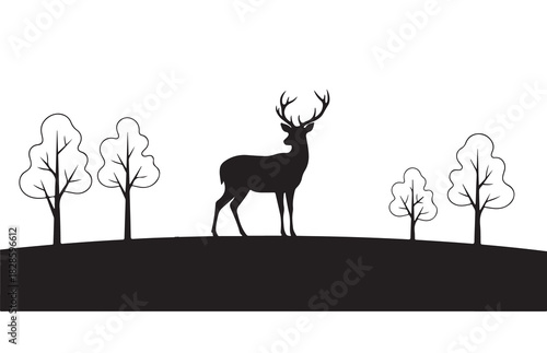 Majestic deer stag with antlers stands on a hill with trees