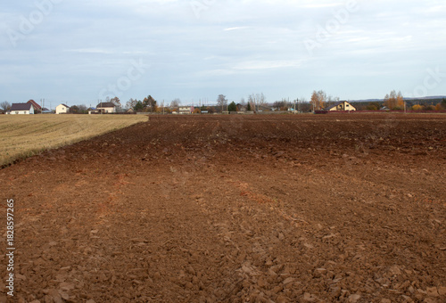 View of an agricultural plowed field in autumn. Concept of agriculture and food security