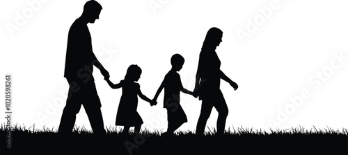 Black silhouette of a family walking hand in hand across a grassy field holding hands