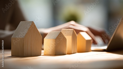 Wooden house models represent the dream of home ownership reflecting family life comfort stability security belonging and foundation of happiness togetherness and love.