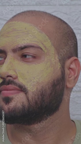 Vertical Video of Man Looking Around with Caly Face Mask on Face