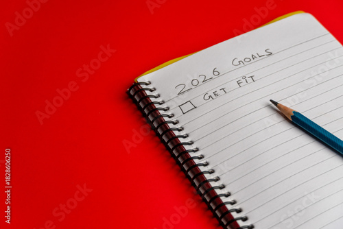 2026 goals list with push pins, an indoor plant and a sticky note on red background. Creative New Year planning and resolution, goals, action, checklist, expectations concept. New Year 2026 card 