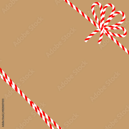 Square craft brown background with candy cane ribbon. Christmas packing string for decoration and present