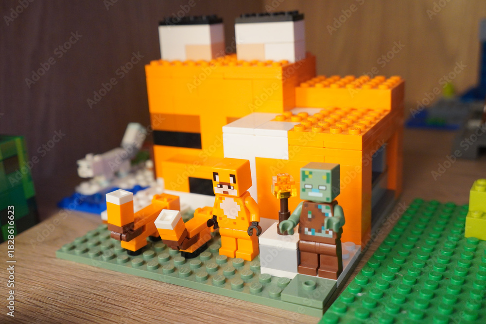 Fototapeta premium Minecraft Lego Fox House with Fox and Zombie Figures on Display