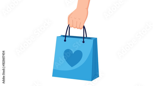Hand holding a blue shopping bag with a heart design, perfect for gifts or purchases