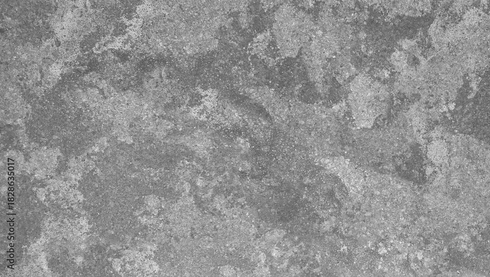 Naklejka premium A close up of a gray stone surface with a rough and uneven texture creating a mottled appearance