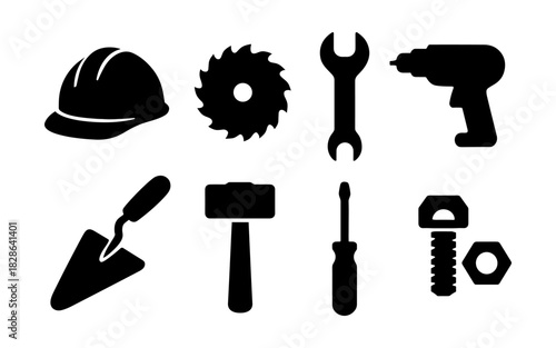 Silhouette construction tools icon set featuring hard hat and power drill