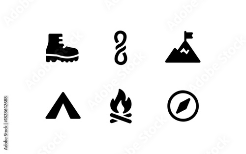 Outdoor adventure icons set: camping, hiking, and navigation symbols in silhouette style