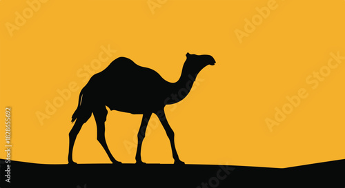 Silhouette of a camel walking across a desert landscape against a warm, golden sunset or sunrise sky.