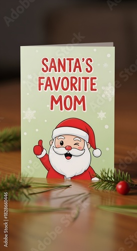 Santa's favorite mom, cute greeting card on table