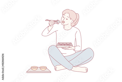 young woman enjoying bowl of ramen while sitting cross-legged at home, relaxed casual late-night meal scene