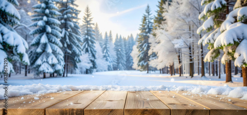Wallpaper Mural Empty wooden table covered in snow with winter forest background Torontodigital.ca