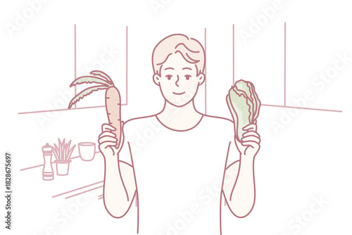 man comparing banana and lettuce in kitchen while weighing healthy meal options, standing at counter with produce and utensils visible thoughtful expression communicates nutrition