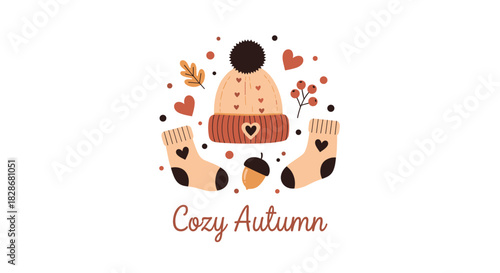 A charming 'Cozy Autumn' card illustration with a warm knitted hat and socks an acorn and berries arranged in a circle.