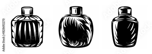 Three uniquely shaped dark shampoo bottles with textured glass and metallic caps presented side by side.