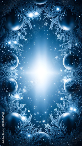 A festive blue holiday frame of frosted pine branches and shiny baubles surrounding a bright, sparkling central light.