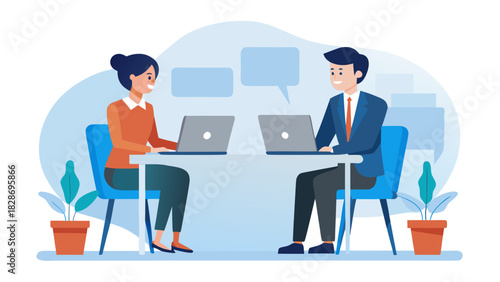 Two professionals collaborating and communicating while working on laptops at a modern office desk