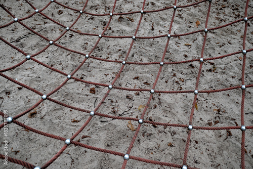 Close up of a net on a playground in a public park.