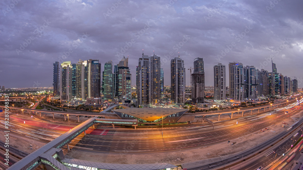 Obraz premium Aerial top view to Sheikh Zayed road near Dubai Marina and JLT day to night timelapse, Dubai.