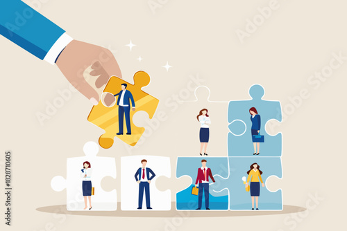 Hand placing a golden puzzle piece with a businessman into a team of diverse professionals