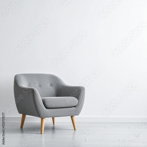 Wallpaper Mural Gray Armchair with Wooden Legs Against a White Wall furniture interior Torontodigital.ca