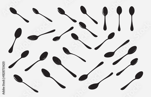 Monochromatic Background of Spoons in Various Positions and Angles on Light Backdrop