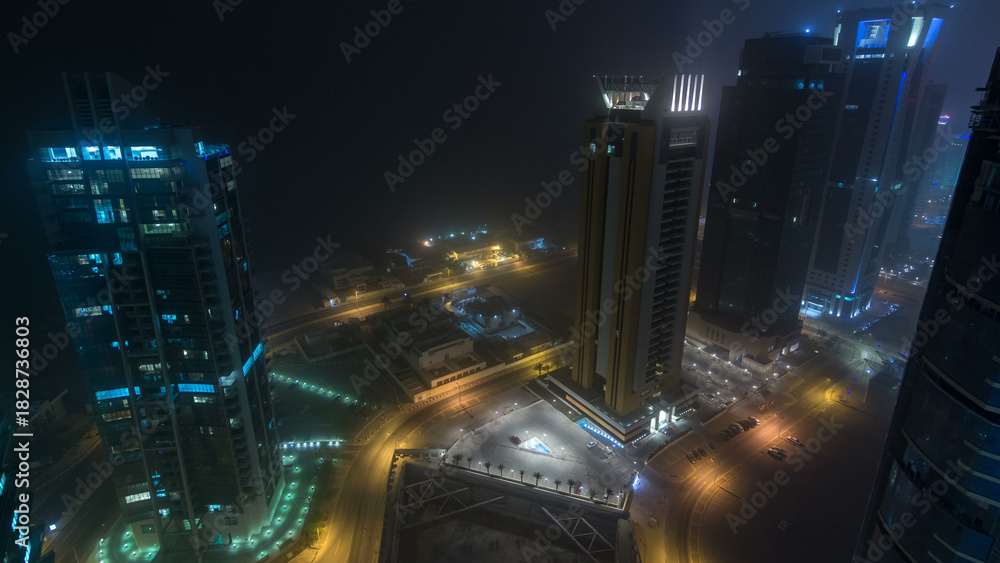 Obraz premium The skyline of the West Bay area from top in Doha day to night timelapse, Qatar.