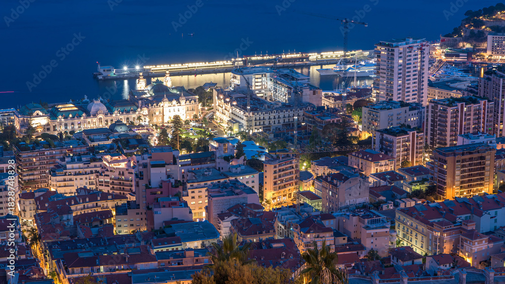 Obraz premium Cityscape of Monte Carlo, Monaco day to night timelapse with roofs of buildings after summer sunset.