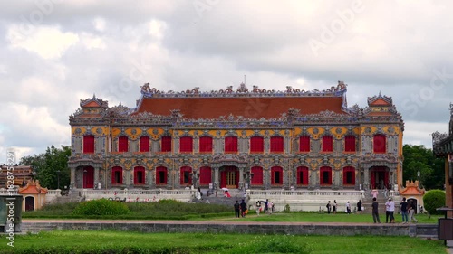 Wallpaper Mural The magnificent Kien Trung Palace features vibrant yellow walls, red doors, and elaborate mosaic patterns under a cloudy sky. Torontodigital.ca