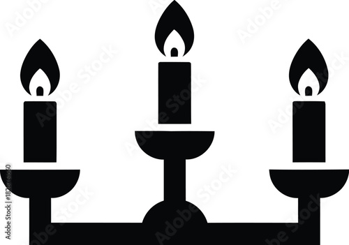 A classic three branched candelabra holding lit candles in a simple silhouette style